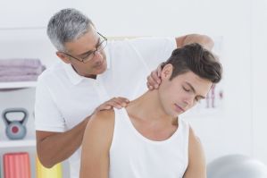 neck-pain-doctor-stretching-therapist-wavebreakmedia-istock_000068946871_medium